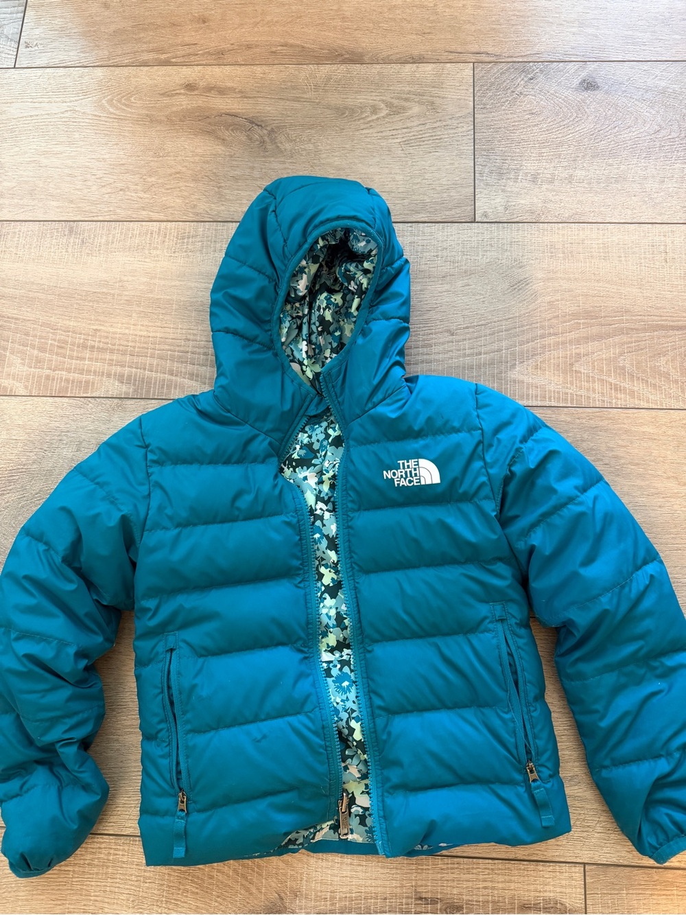 The North Face Kids Teal Hooded Puffer Jacket with Patterned Lining (reversible)
